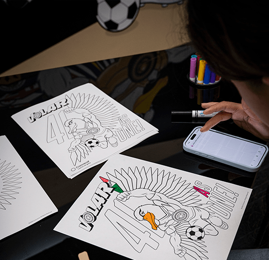 image: A girl coloring with markers 